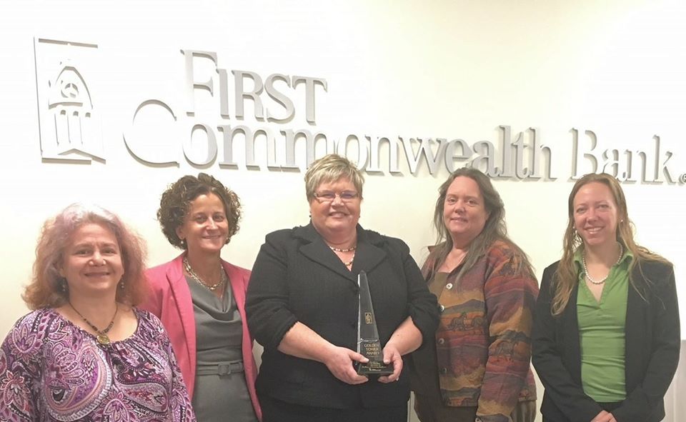Elevate Northland Co-Founders receiving an award from First Commonwealth Bank